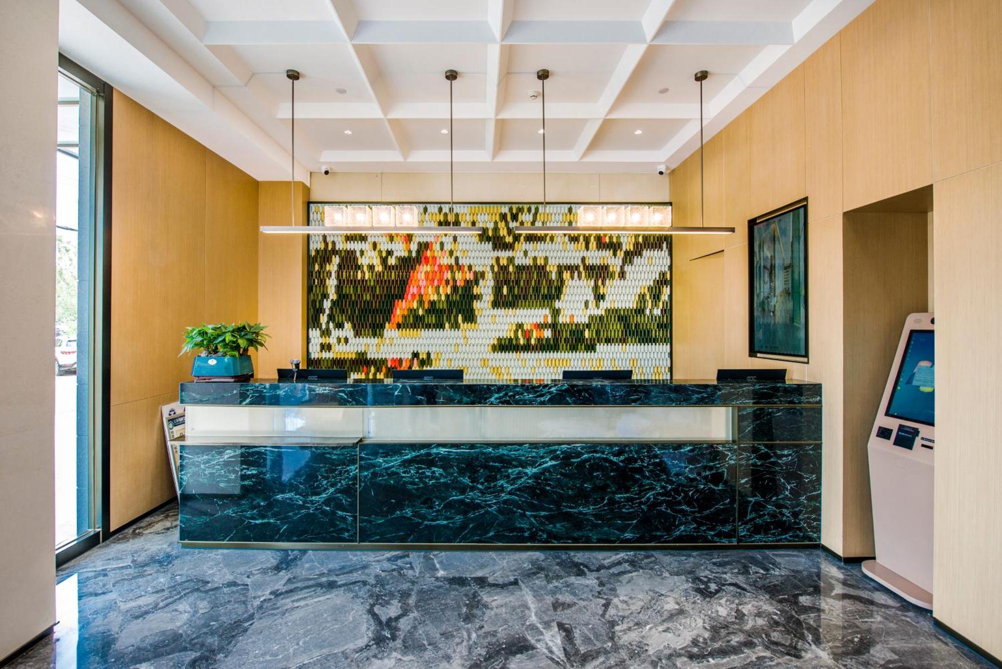 Yiwu Baide Theme Hotel Buitenkant foto