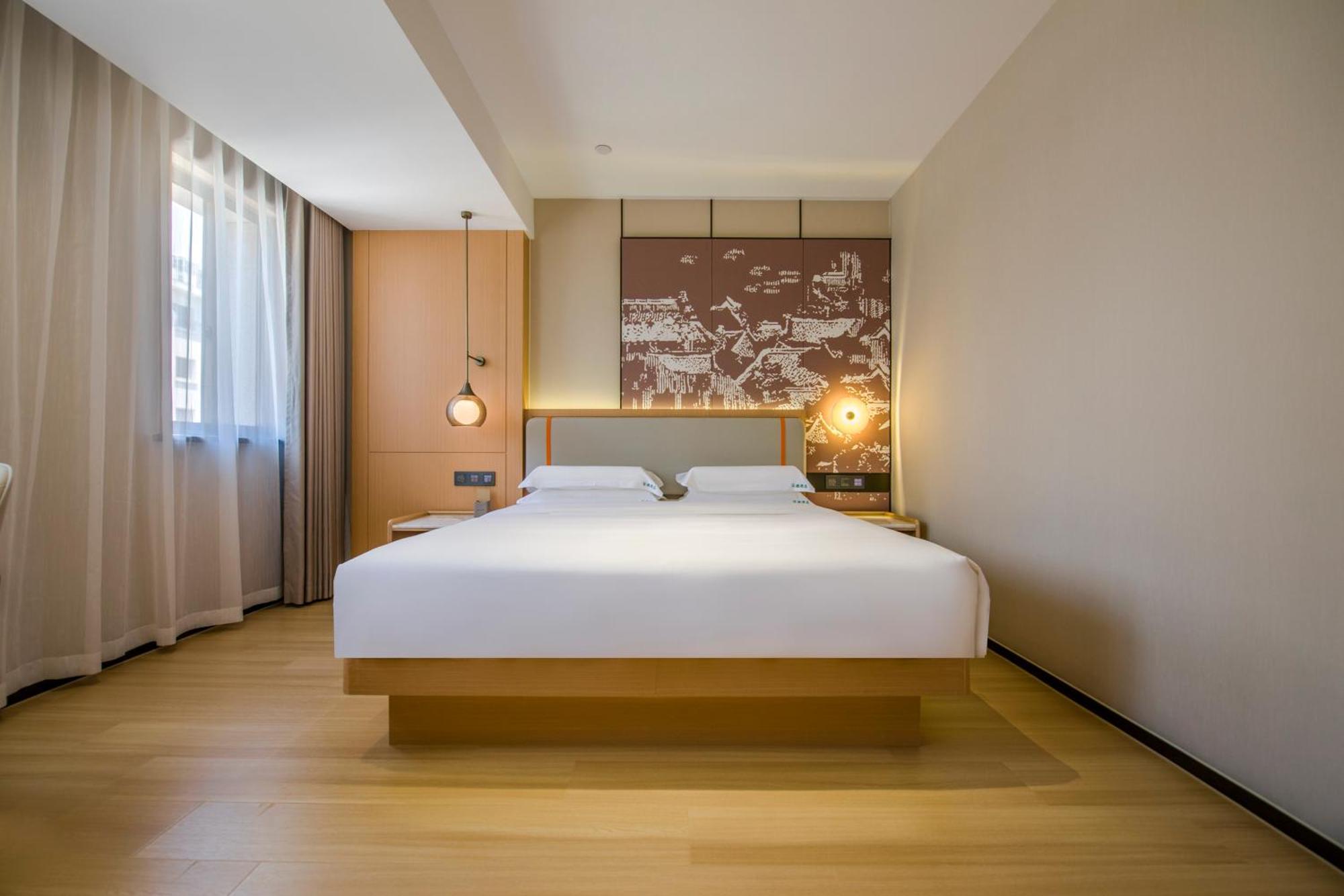 Yiwu Baide Theme Hotel Buitenkant foto