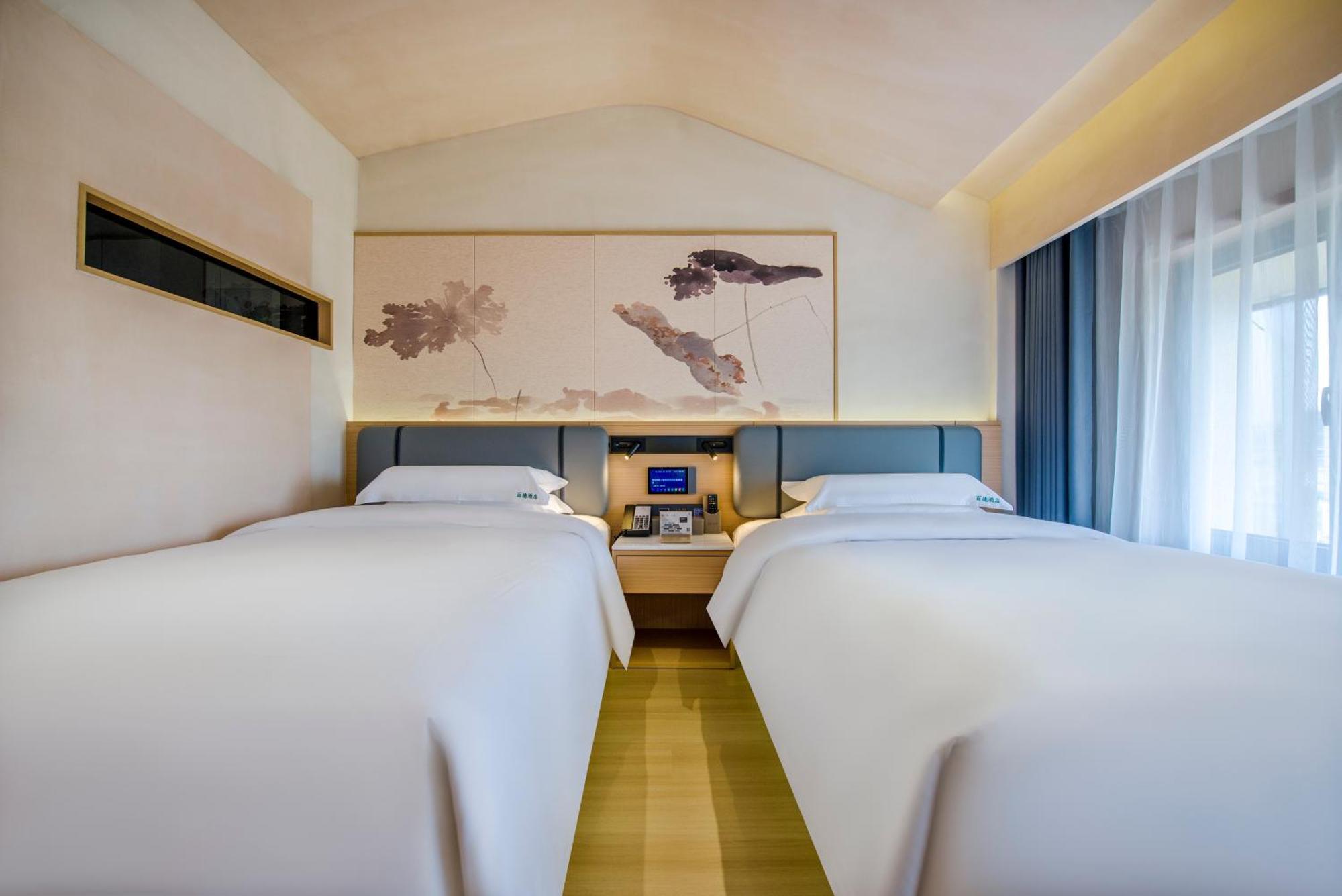 Yiwu Baide Theme Hotel Buitenkant foto
